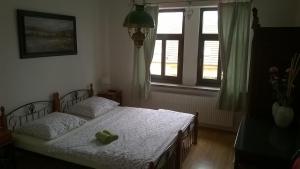 Postel nebo postele na pokoji v ubytování Penzion Večerka