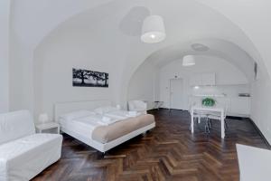 Postel nebo postele na pokoji v ubytování TGM Hotel Residence
