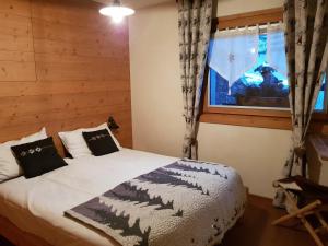 A bed or beds in a room at Chalet Teo e Marianna