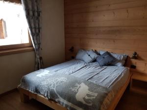 A bed or beds in a room at Chalet Teo e Marianna