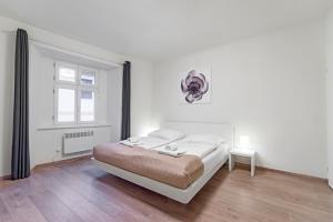 Postel nebo postele na pokoji v ubytování TGM Hotel Residence