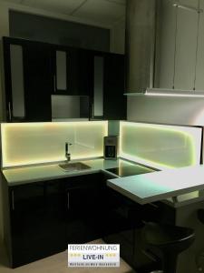 Kuchyň nebo kuchyňský kout v ubytování Tiny Apartment LIVE-IN Wertheim am Main