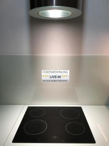 Kuchyň nebo kuchyňský kout v ubytování Tiny Apartment LIVE-IN Wertheim am Main