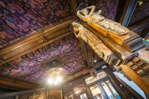 a statue of a woman hanging from a ceiling in a building at Hume Hotel & Spa in Nelson