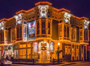 a large building with lights on it at night at Victorian Inn in Ferndale