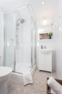 a bathroom with a shower and a toilet and a sink at Krakow B&B - Old Town in Krakow