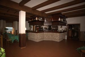 a rendering of a restaurant with a bar at Hotel Quercia Antica in San Marino