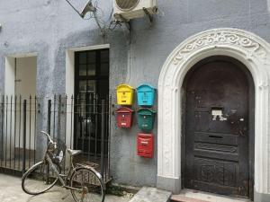 a bike parked in front of a building with a door at Shanghai Lane 里弄公寓 in Shanghai