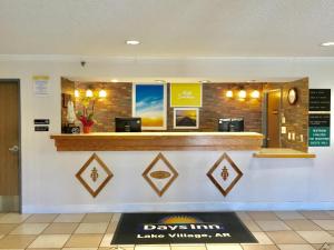 a davis inn bar with a sign on the counter at Days Inn by Wyndham Lake Village in Lake Village +37 photos