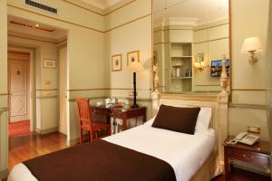 Giường trong phòng chung tại Hotel Degli Aranci