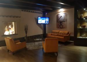Телевизор и/или развлекательный центр в Il Borghetto Hotel Ristorante