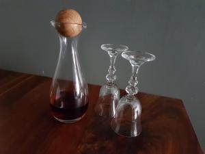 a vase with an egg and two glasses on a table at 178 Club in Pretoria