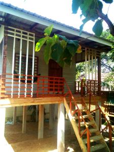 a house with a staircase in front of it at Hutyee Boat Bungalow in Ko Lanta +17 photos