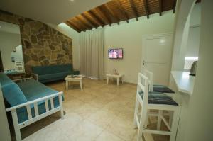 a living room with two beds and a couch at MyroAndrou Beach Hotel Apartments in Protaras