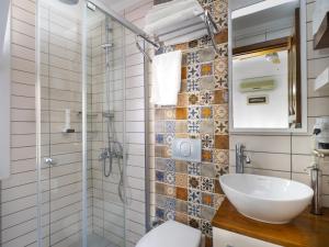 a bathroom with a toilet and a sink and a shower at Hideaway in Kaş