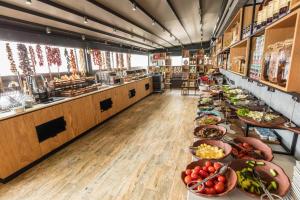 a kitchen with a bunch of plates of food at Sinema Hotel Ordu in Ordu