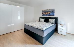 Posteľ alebo postele v izbe v ubytovaní Garden Towers Apartments