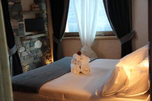Postel nebo postele na pokoji v ubytování B&B Lo Matsòn