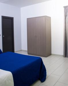 Posteľ alebo postele v izbe v ubytovaní Hotel Cristian