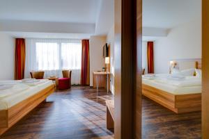 Postel nebo postele na pokoji v ubytování Ferien Hotel Rennsteigblick