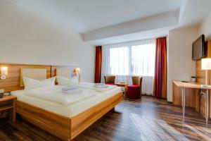 Postel nebo postele na pokoji v ubytování Ferien Hotel Rennsteigblick