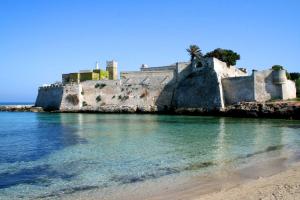 a castle on the shore of a beach at Eden De Martino in Monopoli