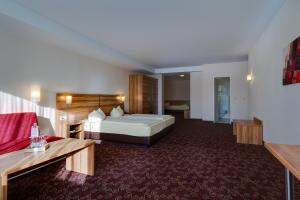 Postel nebo postele na pokoji v ubytování Ferien Hotel Rennsteigblick