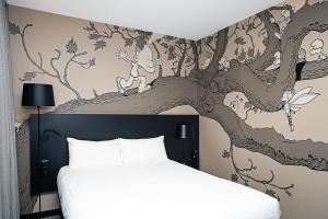 Postel nebo postele na pokoji v ubytování ibis Styles Genève Carouge