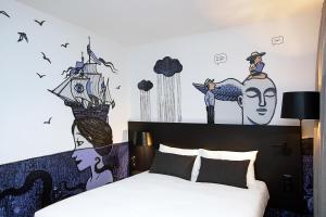 Postel nebo postele na pokoji v ubytování ibis Styles Genève Carouge