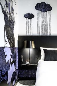 Postel nebo postele na pokoji v ubytování ibis Styles Genève Carouge