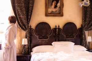 Posteľ alebo postele v izbe v ubytovaní Novecento Boutique Hotel