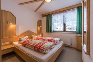 Postel nebo postele na pokoji v ubytování Haus Dorfschmied