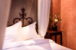 Posteľ alebo postele v izbe v ubytovaní Novecento Boutique Hotel