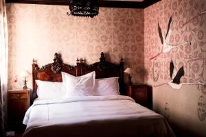 Posteľ alebo postele v izbe v ubytovaní Novecento Boutique Hotel