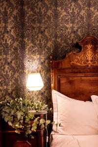 Posteľ alebo postele v izbe v ubytovaní Novecento Boutique Hotel