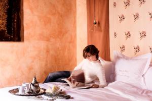 Posteľ alebo postele v izbe v ubytovaní Novecento Boutique Hotel