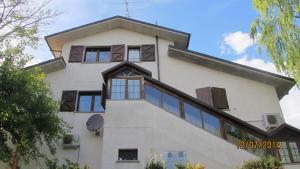 a large white building with windows on top of it at Locanda San Marino Al Coppo in Monte Grimano Terme
