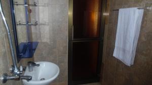 a bathroom with a sink and a shower at Bright Star Hotel in Arusha