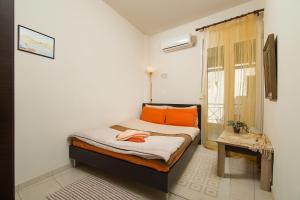 Tempat tidur dalam kamar di Home Suites