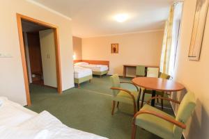Posteľ alebo postele v izbe v ubytovaní Hotel Na Kocandě