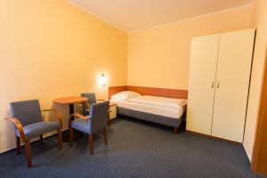 Posteľ alebo postele v izbe v ubytovaní Hotel Na Kocandě