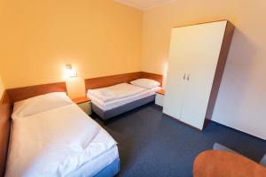 Posteľ alebo postele v izbe v ubytovaní Hotel Na Kocandě
