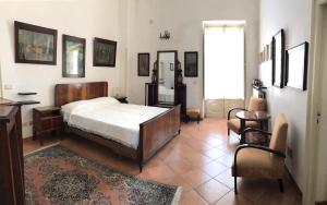 Ένα ή περισσότερα κρεβάτια σε δωμάτιο στο PORTATERRA Antica Dimora