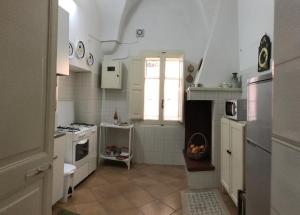 Η κουζίνα ή μικρή κουζίνα στο PORTATERRA Antica Dimora +20 φωτογραφίες