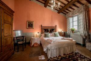 Postel nebo postele na pokoji v ubytování Agriturismo Podere La Rocca