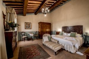 Postel nebo postele na pokoji v ubytování Agriturismo Podere La Rocca