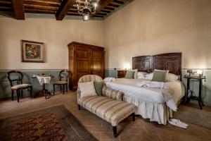 Postel nebo postele na pokoji v ubytování Agriturismo Podere La Rocca + 37 fotografií