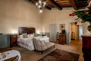 Postel nebo postele na pokoji v ubytování Agriturismo Podere La Rocca