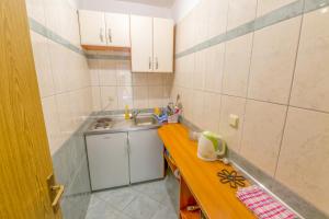 Kuchyň nebo kuchyňský kout v ubytování Rooms Karla