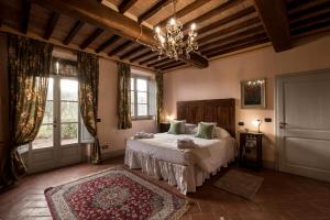 Postel nebo postele na pokoji v ubytování Agriturismo Podere La Rocca